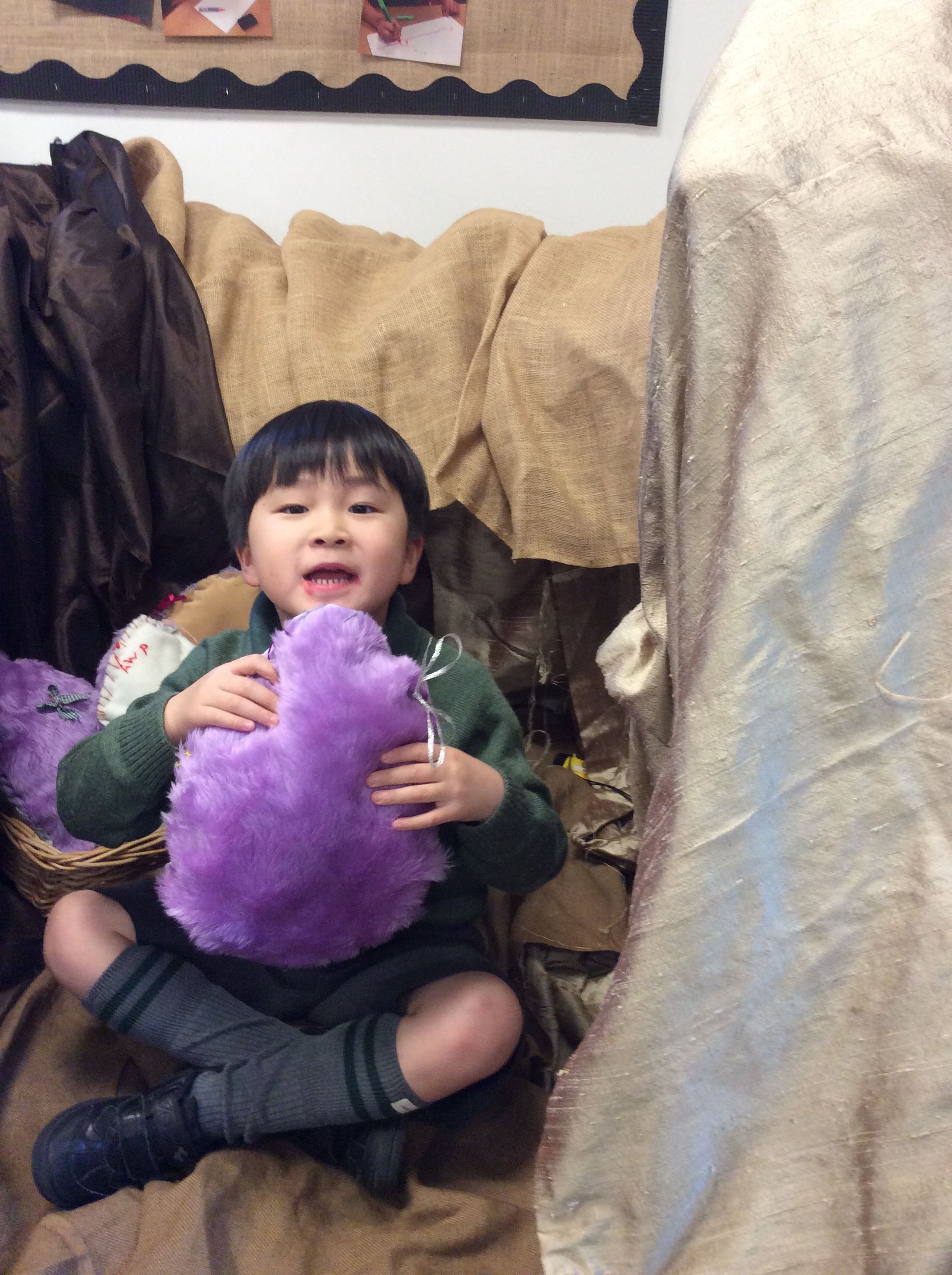 Boy sitting with home made stuffed egg 1