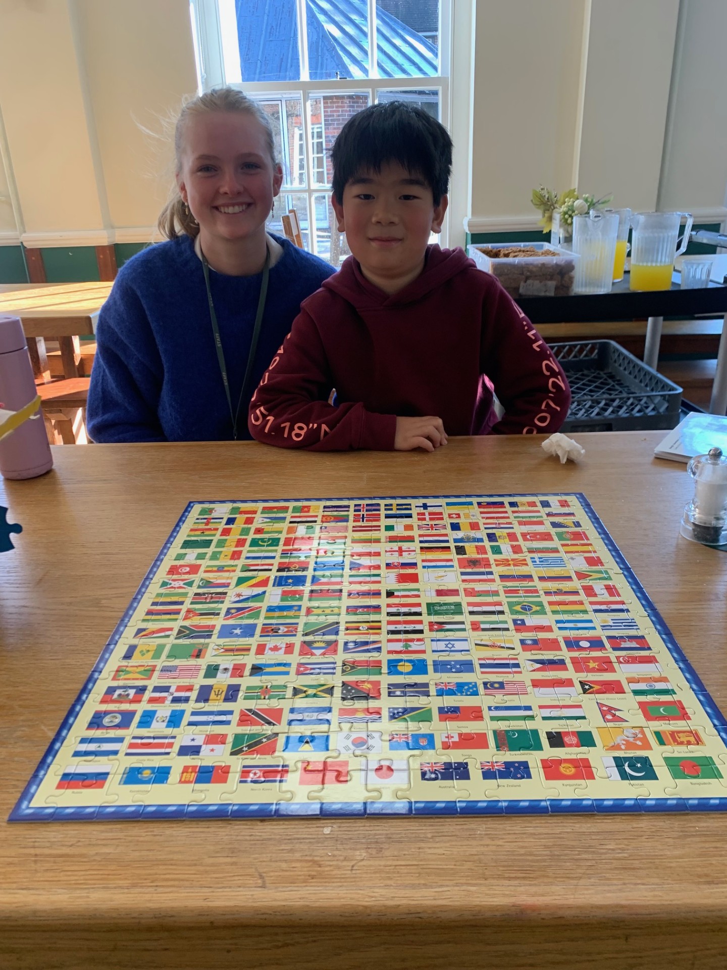 Louis and Jess show off their completed puzzle